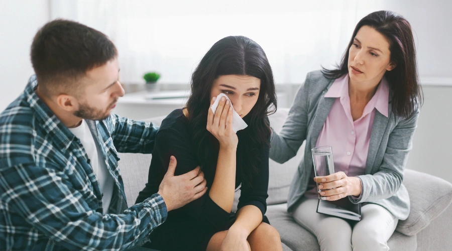 Image of a couple in a therapy session with a counselor